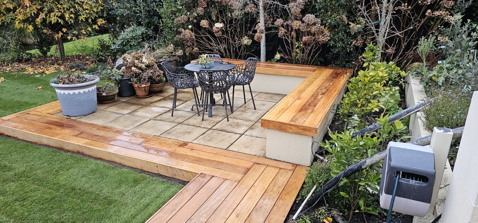 Landscaped patio with timber edging and built-in seating